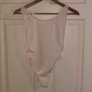 NWT Cotton spandex deep cut bodysuit.